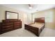 Bedroom with a wooden dresser, bed frame, and large windows at 125 Savannah Estates Dr, Atlanta, GA 30350