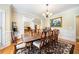 Dining room boasts hardwood floors, a large table, and elegant decor at 125 Savannah Estates Dr, Atlanta, GA 30350