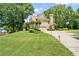 Home exterior featuring an attached garage, basketball hoop and well-kept lawn at 125 Savannah Estates Dr, Atlanta, GA 30350