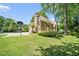 Stunning home showcasing a driveway, basketball hoop, and lush surroundings at 125 Savannah Estates Dr, Atlanta, GA 30350