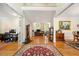 Foyer view leading to living areas, showcasing hardwood floors and detailed trim at 125 Savannah Estates Dr, Atlanta, GA 30350