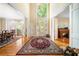 Inviting foyer featuring hardwood floors, high ceilings, and abundant natural light at 125 Savannah Estates Dr, Atlanta, GA 30350