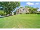 A two-story home boasting a well-manicured lawn and beautiful front facade at 125 Savannah Estates Dr, Atlanta, GA 30350