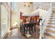 Bright kitchen/dining area features an island, stainless appliances, and large windows at 125 Savannah Estates Dr, Atlanta, GA 30350