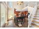 Eat-in kitchen with large windows, stainless appliances, and staircase at 125 Savannah Estates Dr, Atlanta, GA 30350