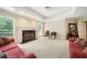 Cozy living room with large windows, neutral walls, fireplace, and carpet flooring at 125 Savannah Estates Dr, Atlanta, GA 30350