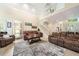 Spacious living room with staircase, comfortable seating, and natural light at 125 Savannah Estates Dr, Atlanta, GA 30350