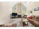 Inviting living room with vaulted ceilings, fireplace, and cozy seating arrangement at 125 Savannah Estates Dr, Atlanta, GA 30350