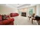 Bright living room with fireplace, large windows, and neutral walls and carpet flooring at 125 Savannah Estates Dr, Atlanta, GA 30350