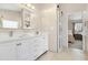 Modern bathroom with dual sinks, white cabinets, and a sliding barn door at 247 Creek View Ln, Acworth, GA 30102