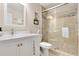 Bathroom featuring glass shower with rain shower head and vanity with quartz countertop at 247 Creek View Ln, Acworth, GA 30102