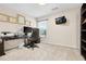 Bright bedroom or office space with wall decor and desk; versatile and inviting at 247 Creek View Ln, Acworth, GA 30102