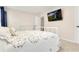 Comfortable bedroom with a bed, dresser, and television for relaxation and entertainment at 247 Creek View Ln, Acworth, GA 30102