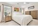 Bright bedroom with neutral tones, large window, and dresser at 247 Creek View Ln, Acworth, GA 30102