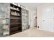 Versatile bedroom space with bookshelves, ample storage, and a clean, organized layout at 247 Creek View Ln, Acworth, GA 30102