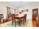 Charming dining room with a traditional table, elegant chandelier, and decorative details at 247 Creek View Ln, Acworth, GA 30102