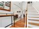 View of the foyer that shows the staircase and dining room with open access to other parts of the home at 247 Creek View Ln, Acworth, GA 30102