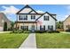 Charming two-story home featuring a well-manicured lawn and inviting front porch at 247 Creek View Ln, Acworth, GA 30102