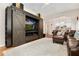 Stylish living room featuring an entertainment center and an open floor plan to the kitchen at 247 Creek View Ln, Acworth, GA 30102
