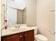 A half bath with tiled shower in background at 2551 Village Creek Se Lndg, Atlanta, GA 30316