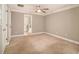 Spacious bedroom features neutral walls, carpet flooring, and ceiling fan at 2551 Village Creek Se Lndg, Atlanta, GA 30316