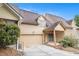 Home featuring garage, covered front door, and mature landscaping at 2551 Village Creek Se Lndg, Atlanta, GA 30316