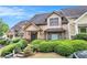 View of home featuring well-maintained yard, stone walkway, and welcoming front door at 2551 Village Creek Se Lndg, Atlanta, GA 30316