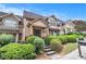 Exterior view of townhome with steps, landscaped yard, and a welcoming entrance at 2551 Village Creek Se Lndg, Atlanta, GA 30316