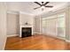 Sun-filled living room showcasing hardwood floors, a fireplace, and a large window at 2551 Village Creek Se Lndg, Atlanta, GA 30316