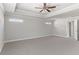 Spacious bedroom has a tray ceiling and neutral tones, offering a serene and relaxing atmosphere at 3926 Lockaby Way, Lawrenceville, GA 30044
