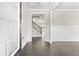 Inviting entryway with hardwood floors, wainscoting, and staircase leading to the upper level at 3926 Lockaby Way, Lawrenceville, GA 30044