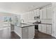 Modern kitchen with granite countertops, stainless steel appliances, and white cabinetry at 3926 Lockaby Way, Lawrenceville, GA 30044