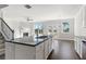 Modern kitchen with granite countertops, stainless steel appliances, and open floor plan at 3926 Lockaby Way, Lawrenceville, GA 30044