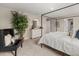Bedroom showcases a black canopy bed, a modern chair and decor accents at 48 Hampton Ter, Dallas, GA 30157