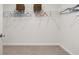 Walk-in closet with white wire shelving, providing ample storage space at 48 Hampton Ter, Dallas, GA 30157