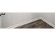Close up shot of luxury vinyl flooring with white baseboards against neutral walls at 48 Hampton Ter, Dallas, GA 30157