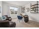Inviting home office with stylish furnishings, shelving, plush armchairs and a window overlooking the neighborhood at 48 Hampton Ter, Dallas, GA 30157