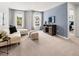 Cozy living room with neutral colors, comfortable seating, and plenty of natural light at 48 Hampton Ter, Dallas, GA 30157