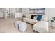 Open living room features sofa, ottomans, and neutral decor at 48 Hampton Ter, Dallas, GA 30157