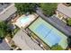 Aerial view of condo community, featuring pool, tennis court, and ample parking at 7750 Roswell Rd # 3D, Atlanta, GA 30350