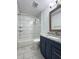Updated bathroom with white subway tile surround tub and modern vanity with granite counters at 7750 Roswell Rd # 3D, Atlanta, GA 30350