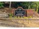 Elegant brick sign for Dunwoody Square community with attractive landscaping at 7750 Roswell Rd # 3D, Atlanta, GA 30350