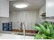 Bright kitchen featuring white cabinets, stainless steel appliances, granite countertops, and hardwood floors at 7750 Roswell Rd # 3D, Atlanta, GA 30350