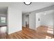 Open-concept living space with hardwood floors, neutral walls, and plenty of natural light at 7750 Roswell Rd # 3D, Atlanta, GA 30350
