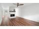 Bright living room featuring hardwood floors, a cozy fireplace, and neutral walls for a modern touch at 7750 Roswell Rd # 3D, Atlanta, GA 30350