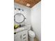 Charming powder room with granite countertops, modern fixtures, and a decorative mirror at 7750 Roswell Rd # 3D, Atlanta, GA 30350