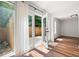 Inviting sunroom with hardwood floors, French doors to the backyard, and plenty of natural light at 7750 Roswell Rd # 3D, Atlanta, GA 30350