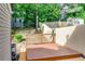 View of a backyard deck with lush greenery surrounding the fenced yard at 2972 Aspen Woods Entry, Atlanta, GA 30360