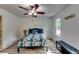 Comfortable bedroom with a floral bedspread, ceiling fan, and bright natural light at 2972 Aspen Woods Entry, Atlanta, GA 30360