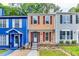 Charming townhome featuring red shutters, and well-manicured landscaping, and convenient front entrance at 2972 Aspen Woods Entry, Atlanta, GA 30360